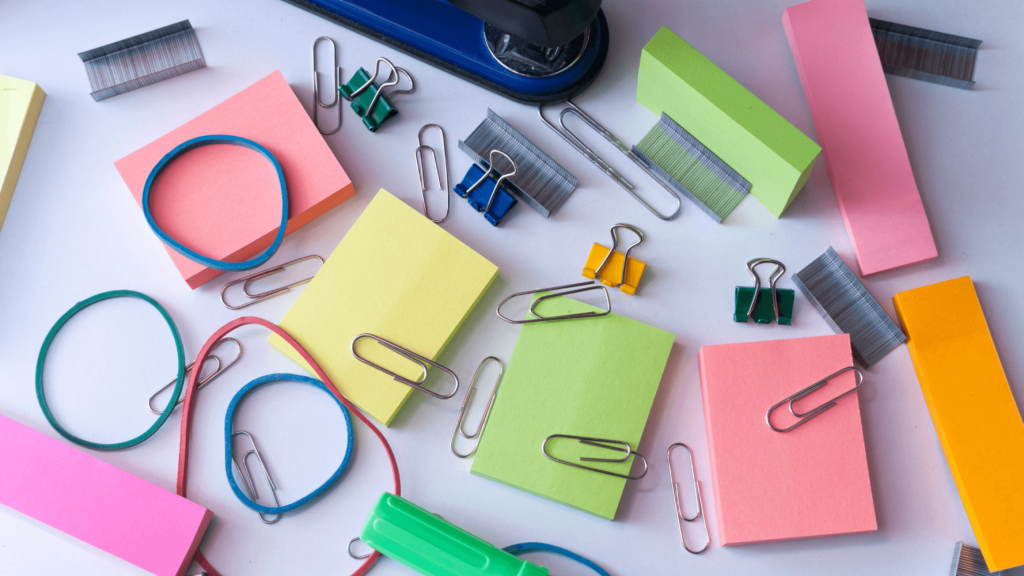 "Reducing Office Expenses from your Budge" pile of office supplies image